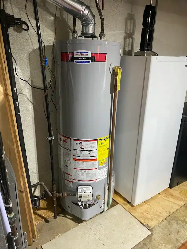 Residential water heater installed beside home mechanical equipment